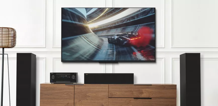 pioneer_lx_vsa_lx805_on_modern_tv_console_with_fast_car_on_tv_1920x934.webp